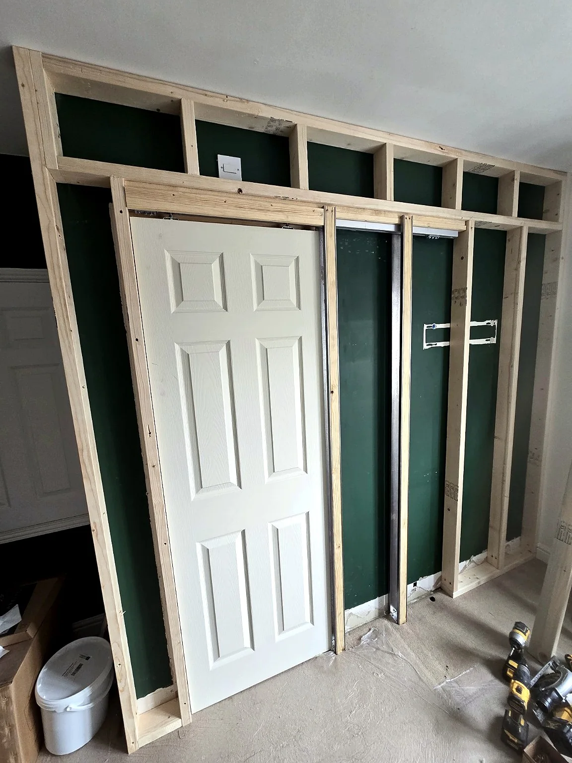 Timber stud framing for a sliding pocket door installation by SM Installations