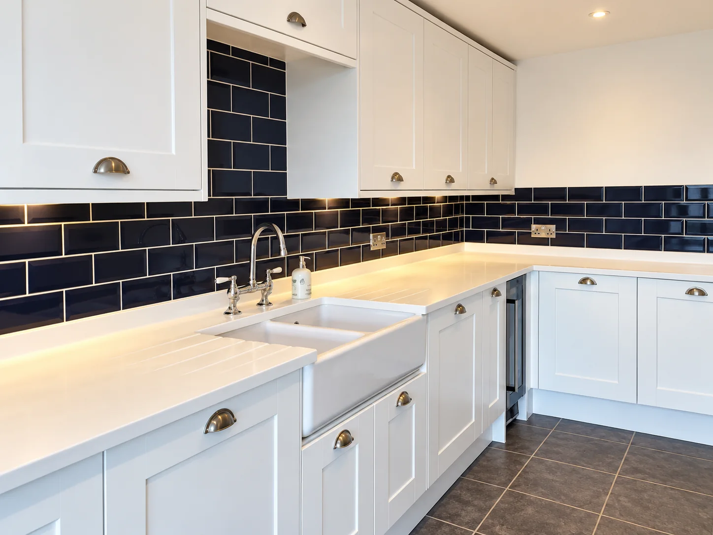 White shaker kitchen with dark tiled splashback fitted by SM Installations