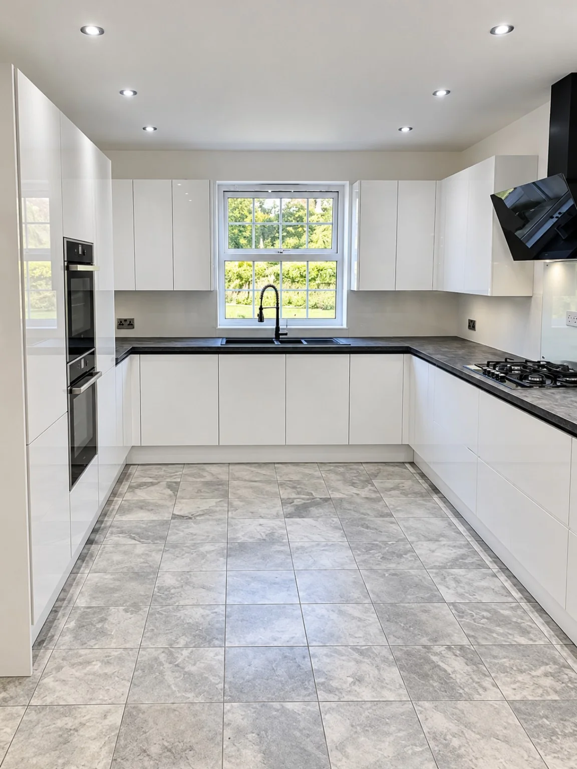 Light fitted kitchen with integrated units completed by SM Installations